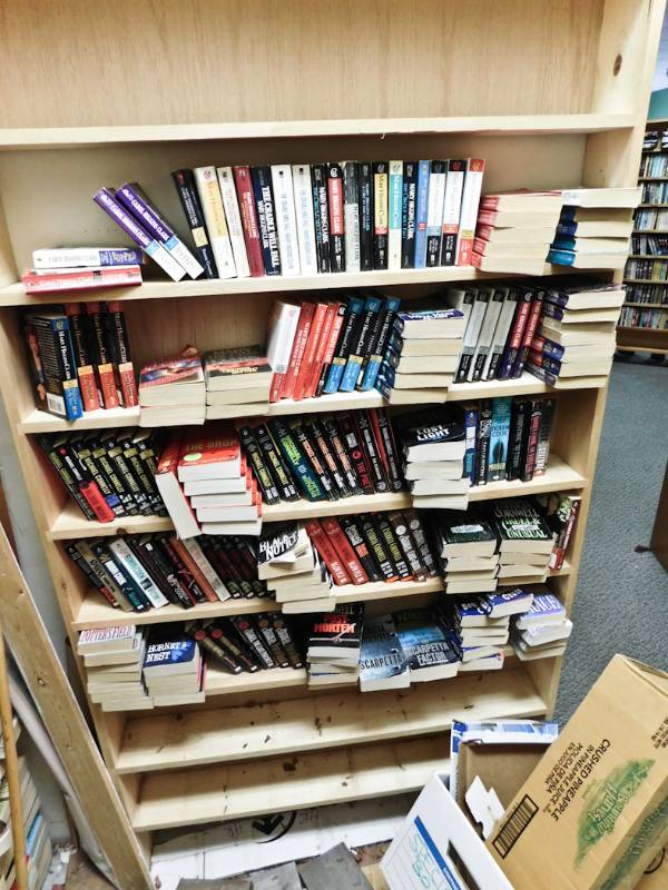 Back room overstock paperback bookshelves