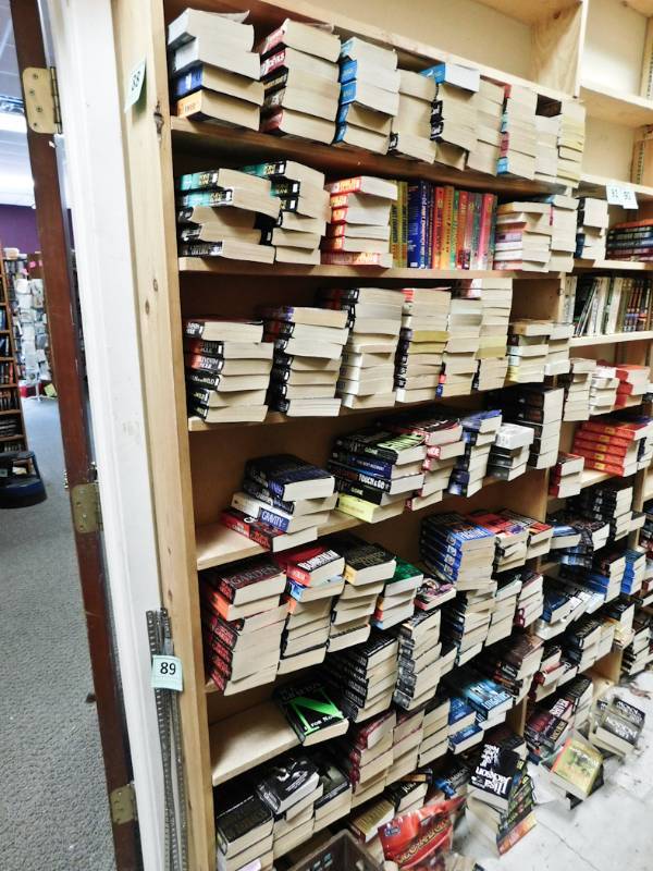 Back room overstock paperback bookshelves