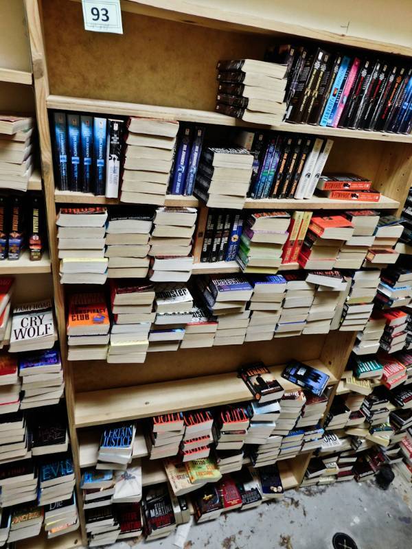 Back room overstock paperback bookshelves