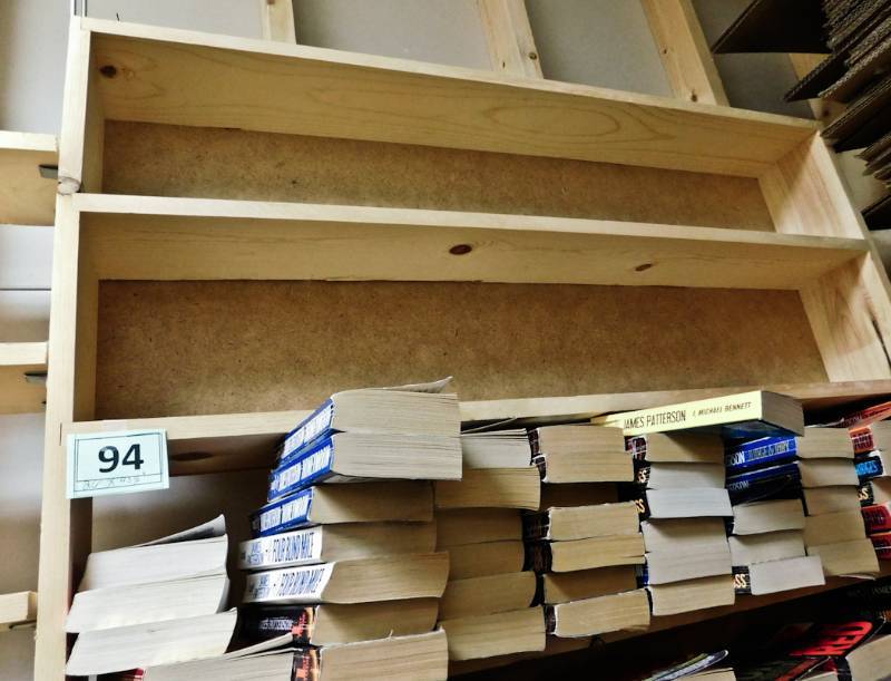 Back room overstock paperback bookshelves