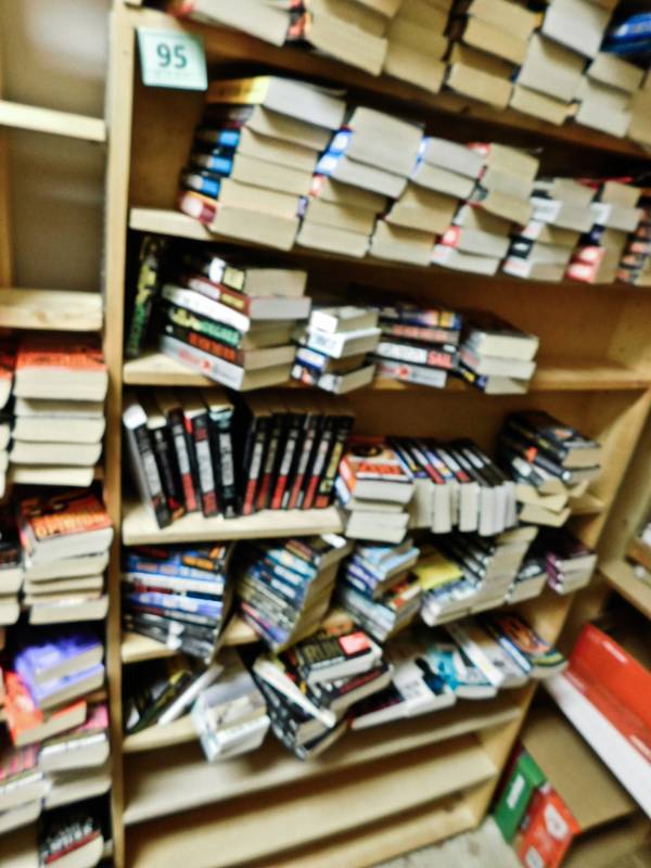 Back room overstock paperback bookshelves