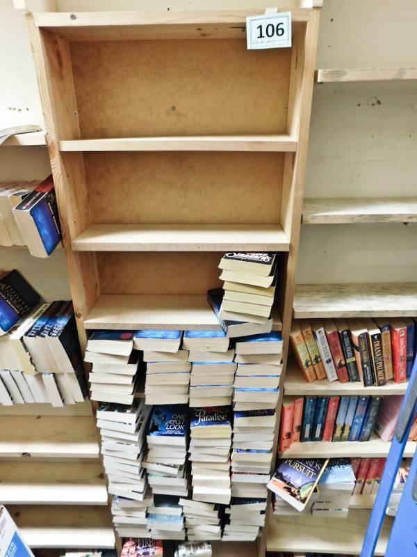 Back room overstock paperback bookshelves