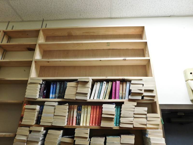 Back room overstock paperback bookshelves