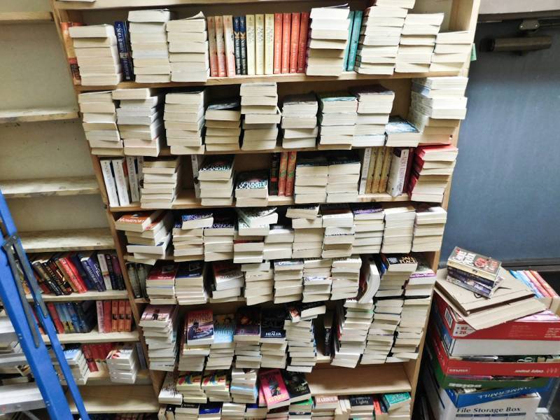 Back room overstock paperback bookshelves