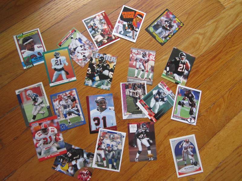 lot 74 image: 20 Deion Sanders cards...