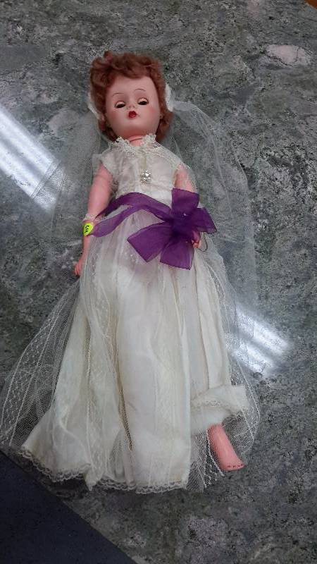 Vintage child doll in wedding dress
