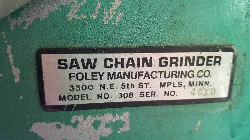 lot 14 image: Chain saw Sharpener  Book included (Foley Manufacturing co.)  Works