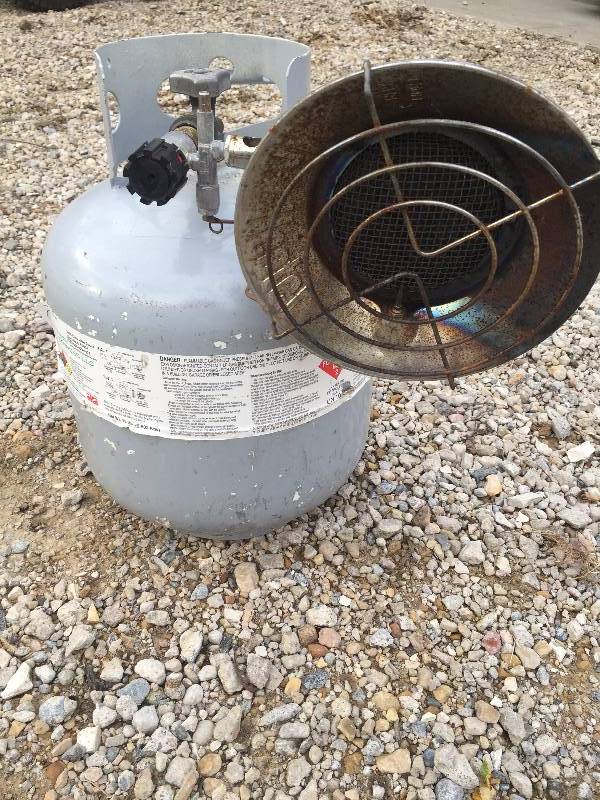 lot 24 image: SUNFLOWER HEATER AND NEW STYLE LP TANK