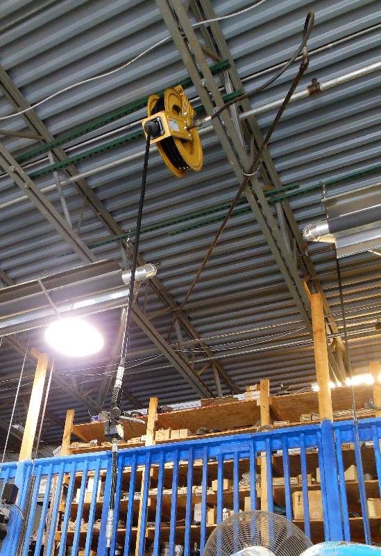 lot 50 image: Updated info and photo Graco Fluid Delivery Hose with Meter - Has already been taken down from its overhead position.