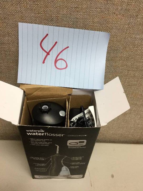 lot 46 image: Waterpik Waterflosser cordless plus open box