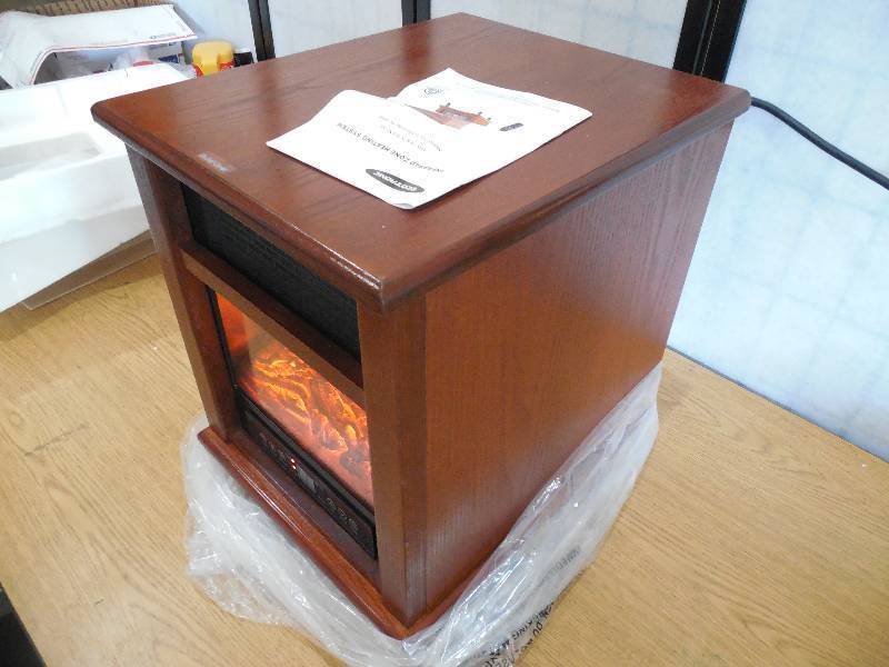 lot 58 image: 1500-Watt 4-Elment Infrared Electric Portable Heater with Remote Control and Fireplace And Bluetooth Speaker