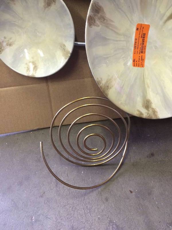 lot 125 image: Stratton Home Dcor Wall Metal Art White and Gold circles it has light scratches
