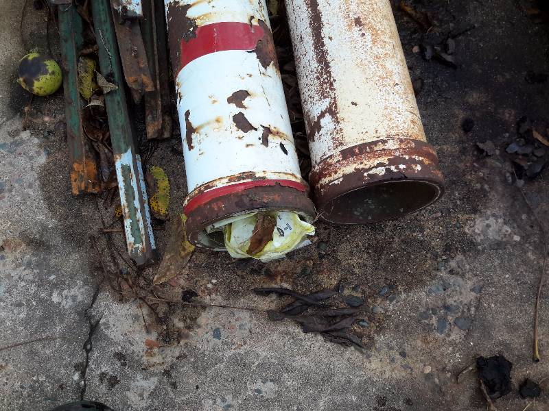 lot 127 image: 3 large steel pipes.. Looks to be 10, 8, 6 ft length.. 1 pole with cement base and misc. metal fence posts