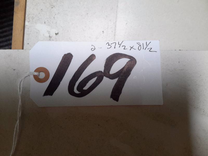 lot 169 image: 2, Solid core doors with 12 moon window cut out.. No hardware.