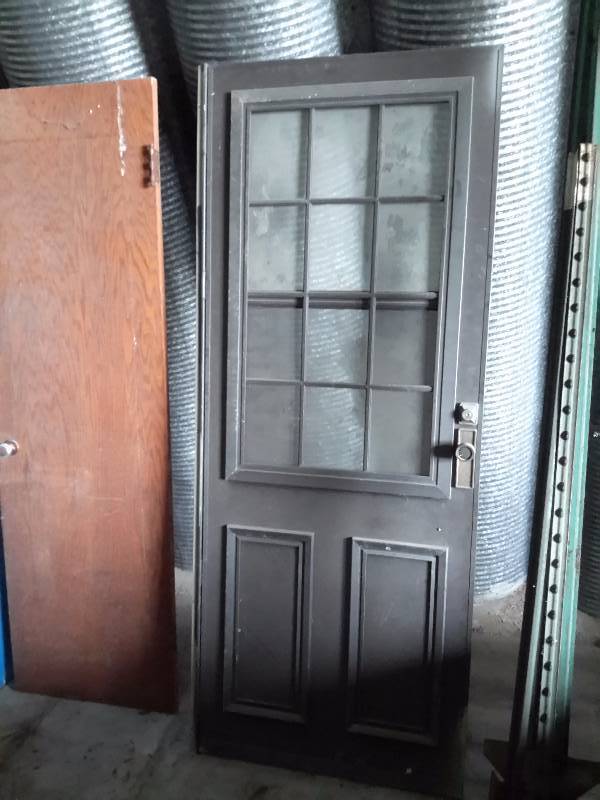 lot 160 image: 32in x 82 in combination door.. 24in x 82 in Inside hollow core door.