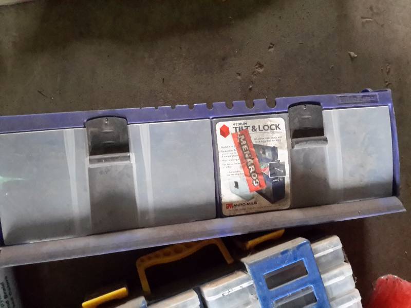 lot 139 image: Misc. plastic storage bins,  bins full of nails and small items, Set of FORD Truck mats.. 100ft 38 in nylon rope