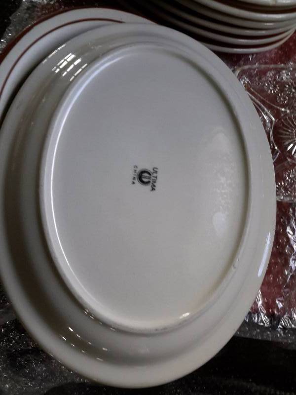 lot 54 image: 11 Ultima platters, blue serving bowl, other misc. service glassware
