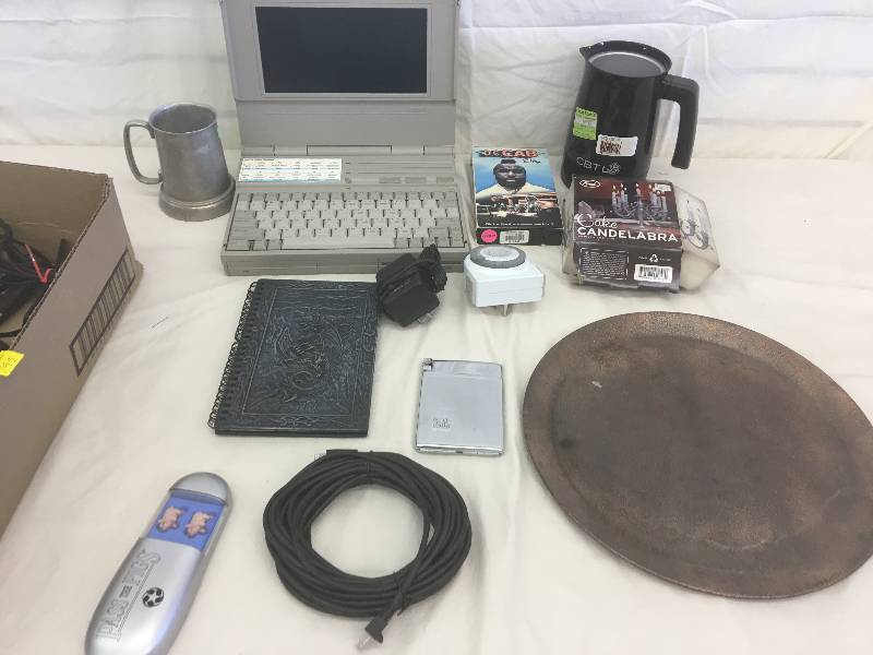 lot 195 image: coffee cup, computer, cords, ipods, lots of items