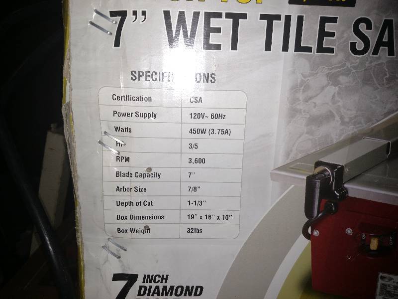 7  bench top Wet tile saw, used but doesnt look like very much