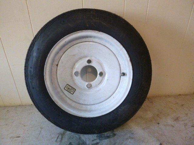 lot 129 image: Power King Trailer Tire with 4 Hole Rim