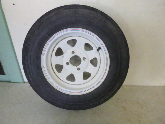 lot 381 image: BF Goodrich Trailer Tire and 4 Hole Rim