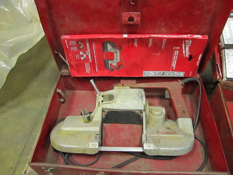 lot 10 image: Milwaukee band saw with extra blade...