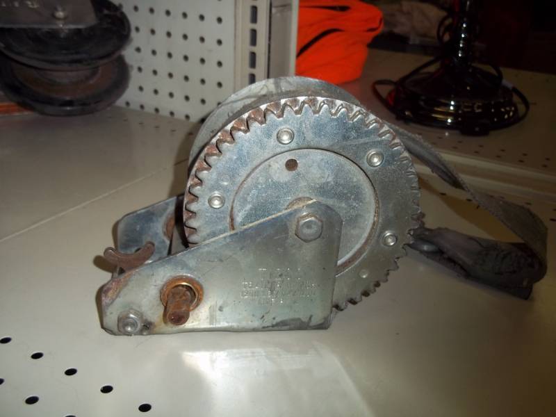 lot 84 image: 1200 lb winch with strap  no handle