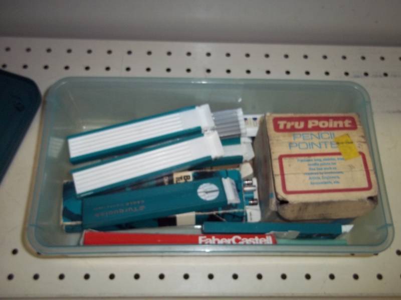 lot 208 image: Pencil sharpener, pencils and lead with tote