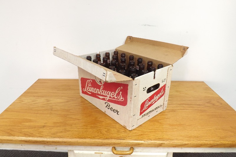 lot 19 image: Vintage 24 Case of Leinies Man Cave Returnables