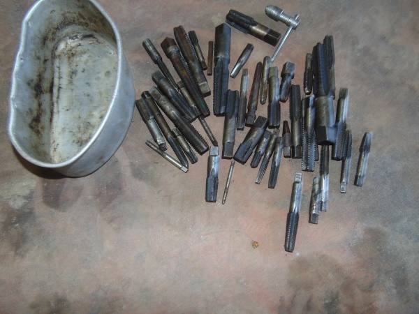 Multiple Size Taps In Metal Tray