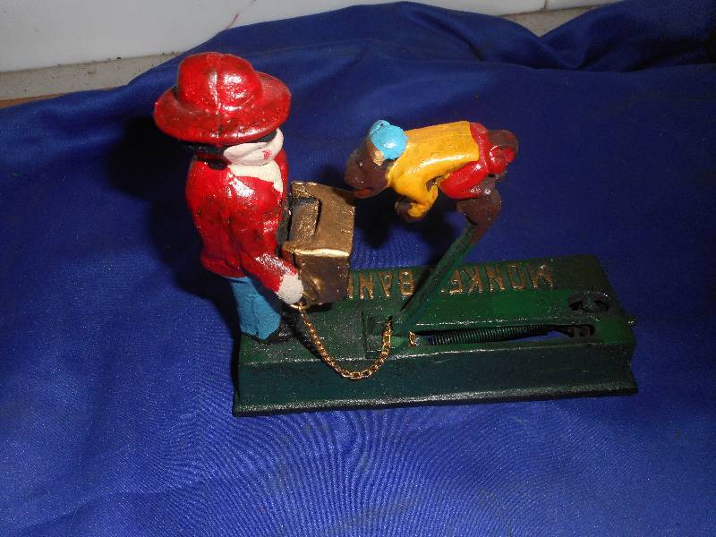 COLLECTIBLE CAST IRON MONKEY BANK