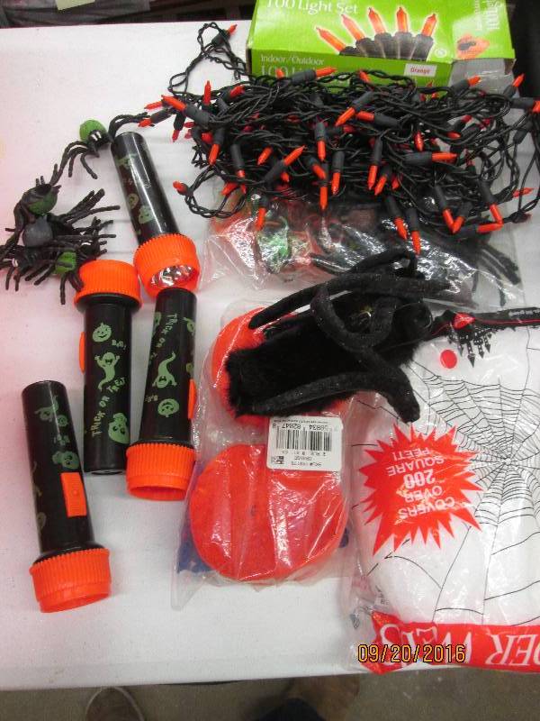 lot 109 image: red tote full of halloween stuff...
