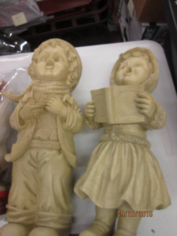 lot 112 image: little girl and little boy statues ...