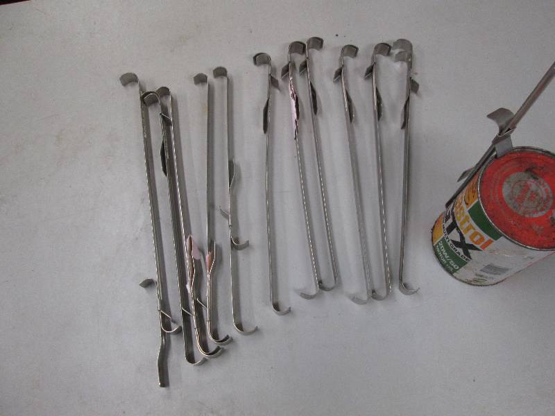 lot 219 image: 12 can holders for cooking over cam...