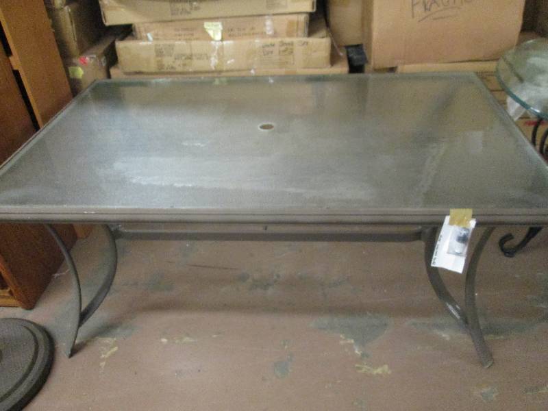 lot 16 image: outdoor table with glass top and 4 ...
