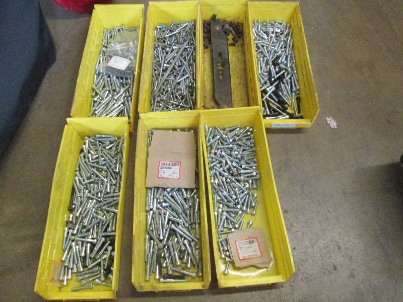 lot 55 image: 7 yellow trays with lots of bolts t...