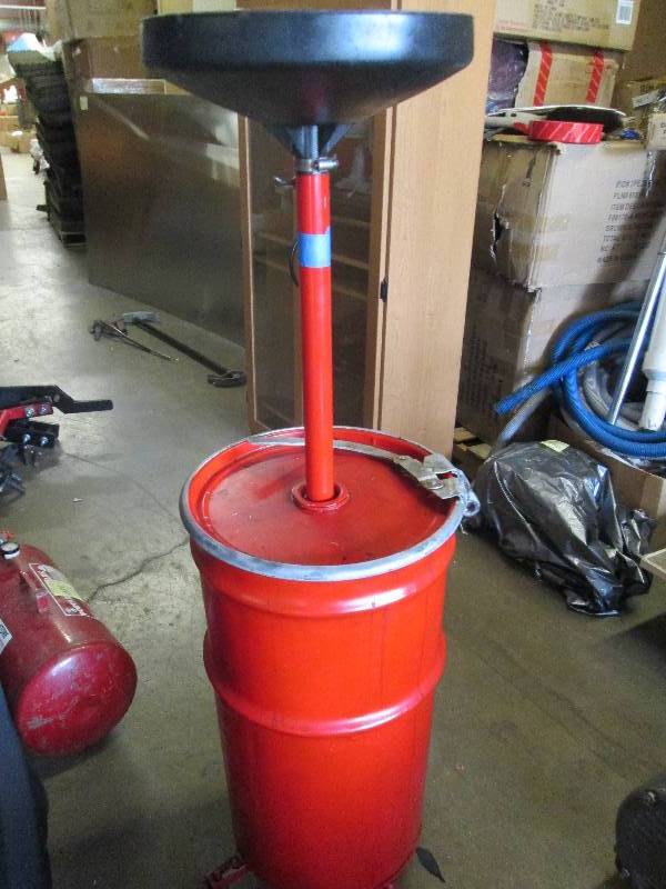 lot 66 image: oil drum with funnel and on wheels ...