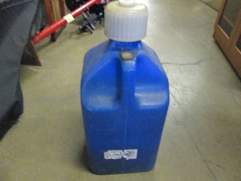 lot 74 image: blue 5 gallon harden plastic jug wi...