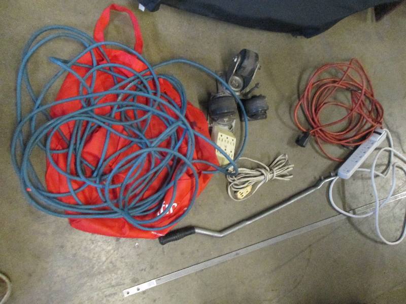 lot 81 image: red bag with a blue extension cord ...