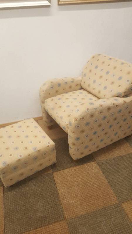 lot 5 image: Arm Chair  Ottoman.  By Flex Steel.  Cool and space saving design.  Ottoman tuck under chair.