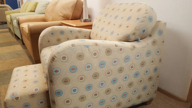 lot 6 image: Arm Chair  Ottoman.  By Flex Steel.  Cool and space saving design.  Ottoman tuck under chair.