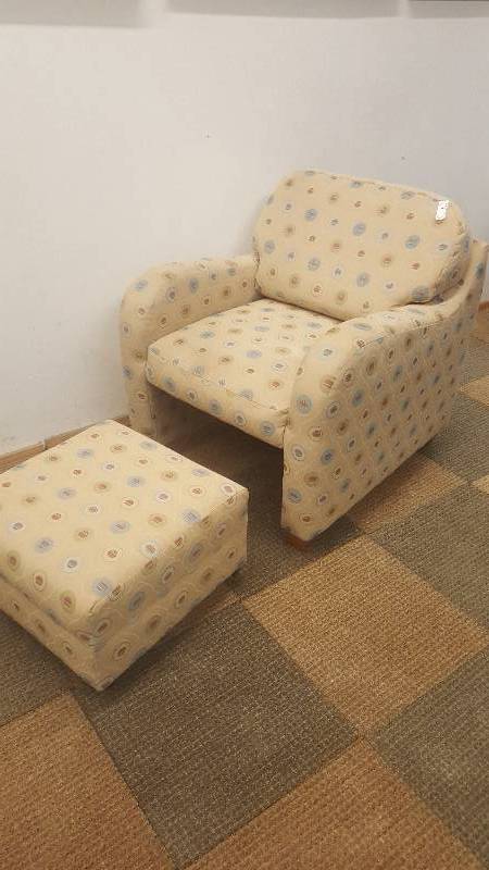 lot 7 image: Arm Chair  Ottoman.  By Flex Steel.  Cool and space saving design.  Ottoman tuck under chair.