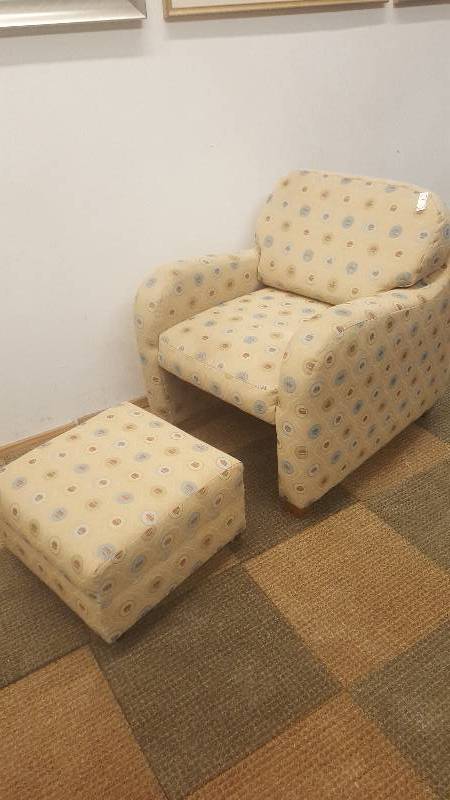 lot 8 image: Arm Chair  Ottoman.  By Flex Steel.  Cool and space saving design.  Ottoman tuck under chair.