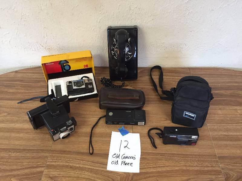FOUR OLD CAMERAS AND ONE ROTARY PHONE