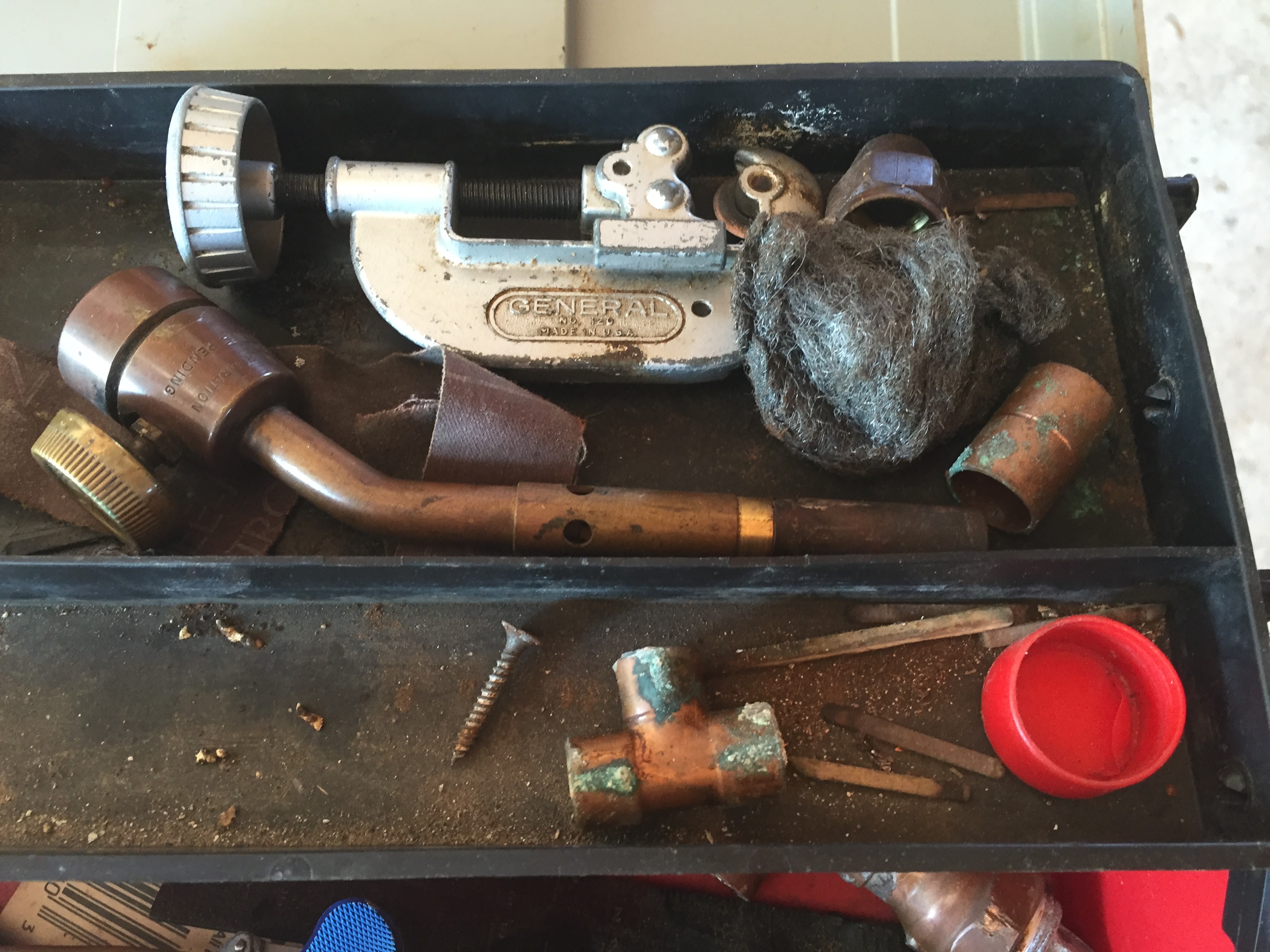 lot 64 image: Toolbox full of plumbing parts