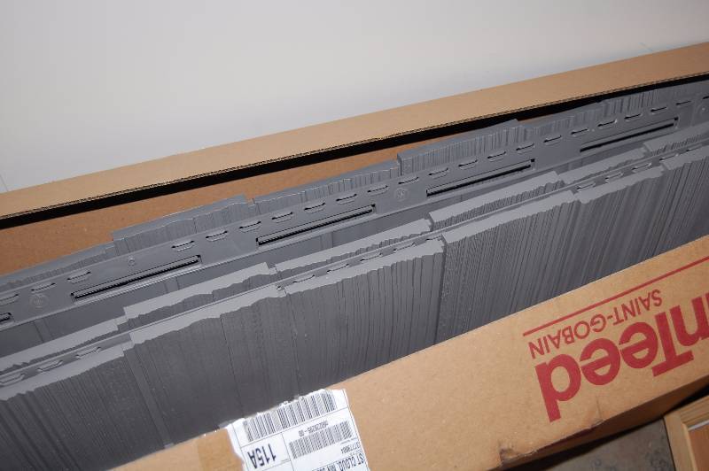 lot 104 image: Cedar Shake Style Plastic Siding