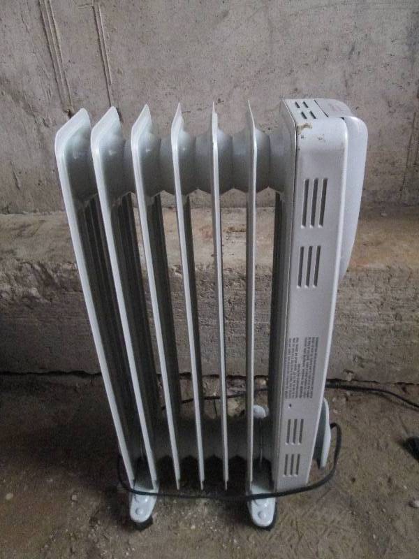 lot 472 image: oil filled radiant heater used unte...