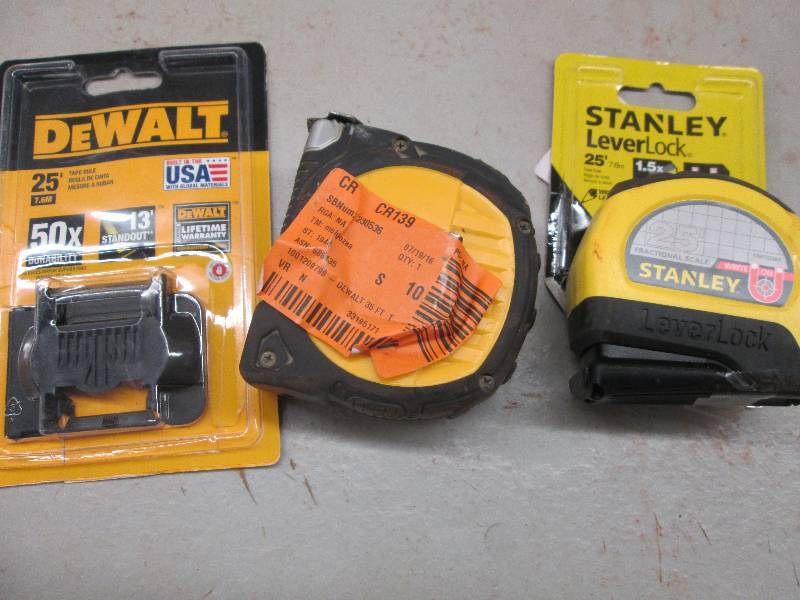 lot 258 image: 2 tape measures 1-25 foot and 1 35 ...