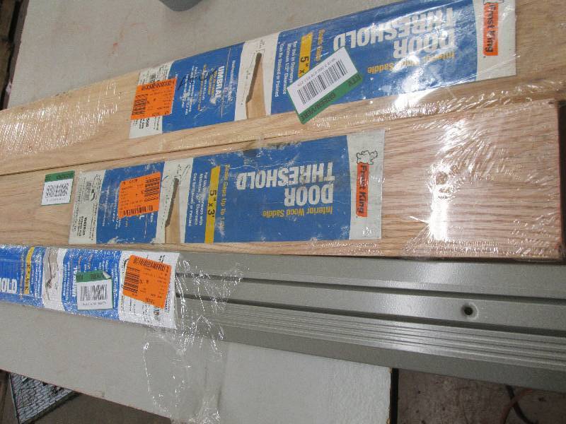 lot 286 image: 2 wood door thresholds and 1 metal ...