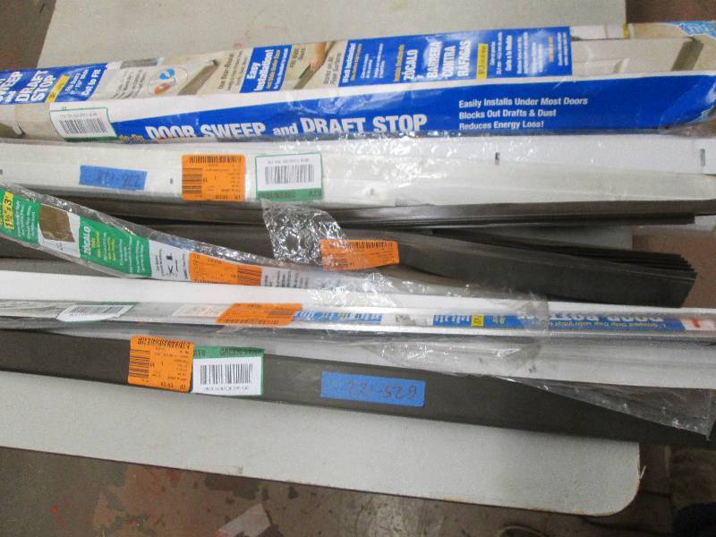 lot 287 image: lot of door sweeps and draft stoppe...